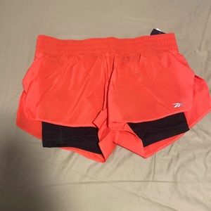 Medium Reebok 2 in 1 running shorts. They have spandex shorts built it.